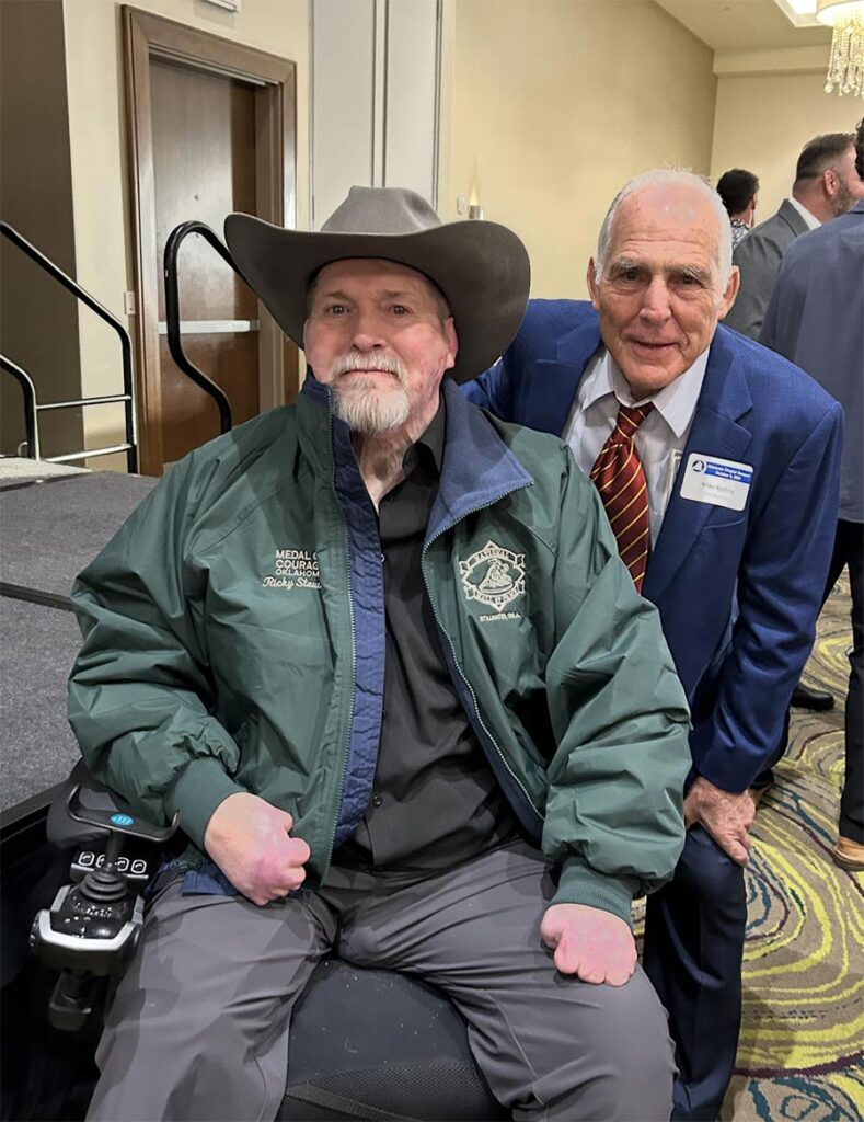 Medal of Courage recipient Ricky Stewart with HS coach Mike Reding. Photo by Mark Kirk.