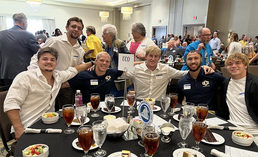 UCO wrestlers L to R, Dylan Brown, Garrett Steidley, Dylan Lucas, Hunter Jump, graduate assistant coach Anthony DesVigne, and Garrett Wells. Photo by Mark Kirk.